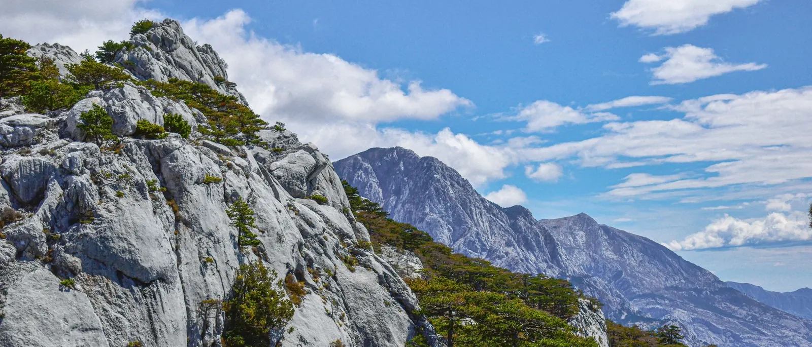 Rugged limestone peaks of the Biokovo mountains under a blue sky
