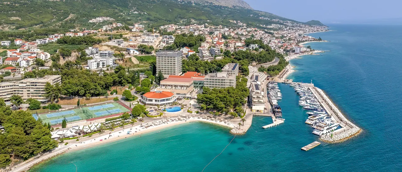 Aerial view of Hotel Le Meridien Lav with its beach and marina, Podstrana